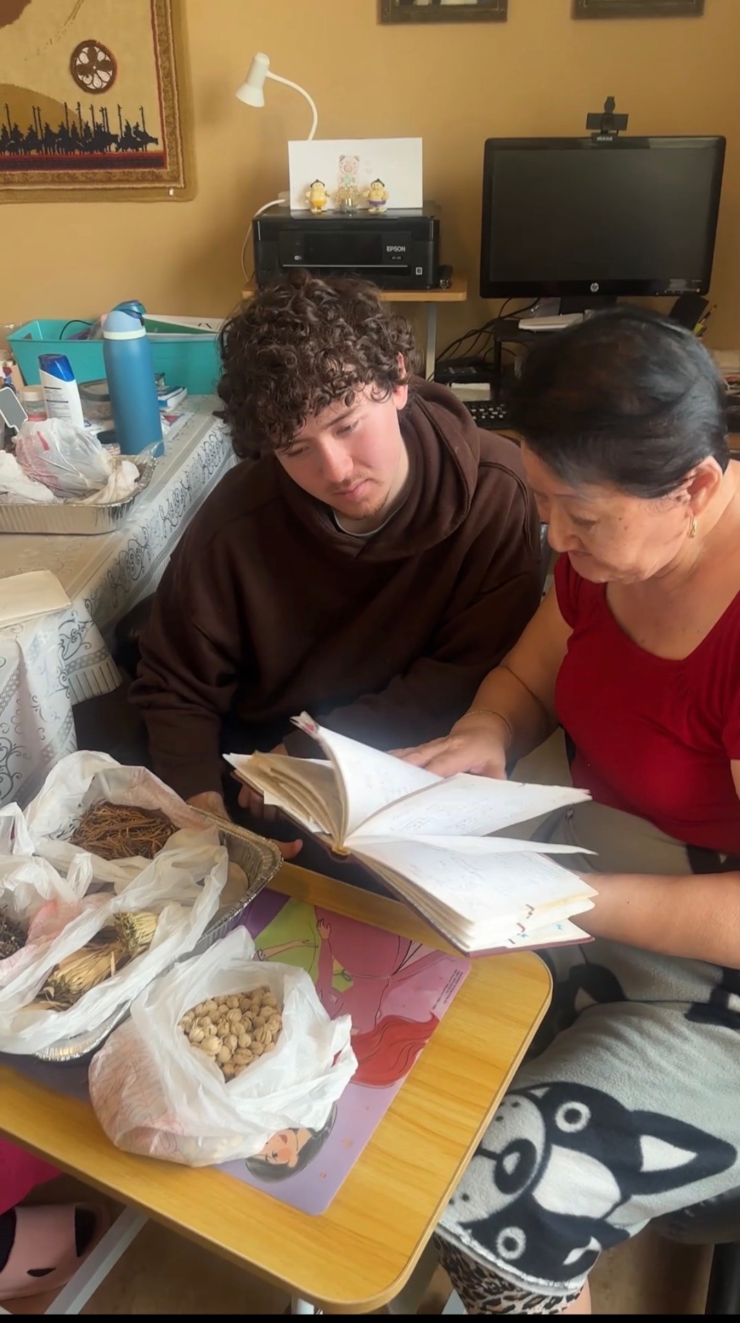 Brandon learning the formulas with his grandmother
